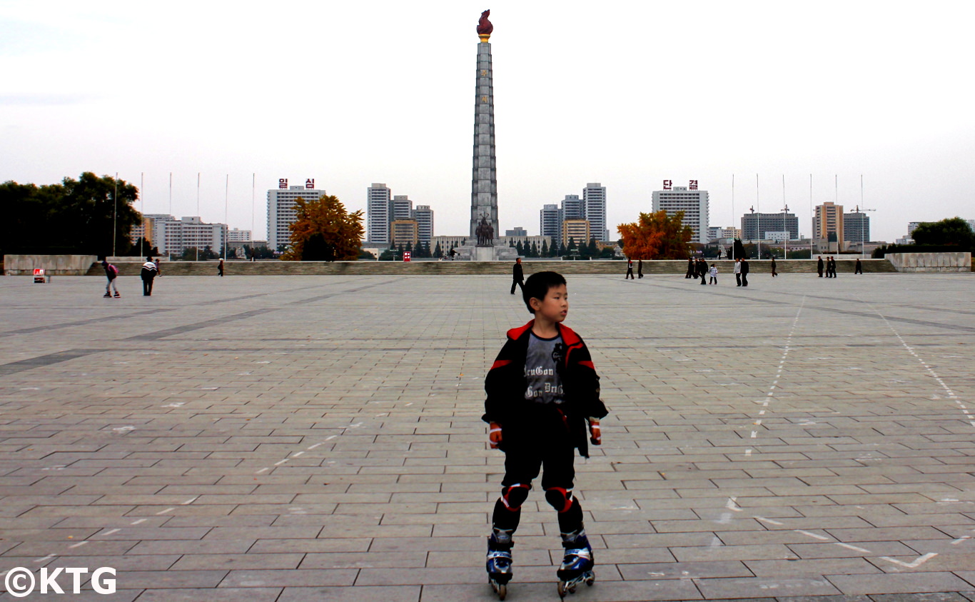 Child roller skating in Kim Il Sung Square, the heart of Pyongyang capital of North Korea (DPRK). Join KTG Tours to discover Kim Il Sung Square!