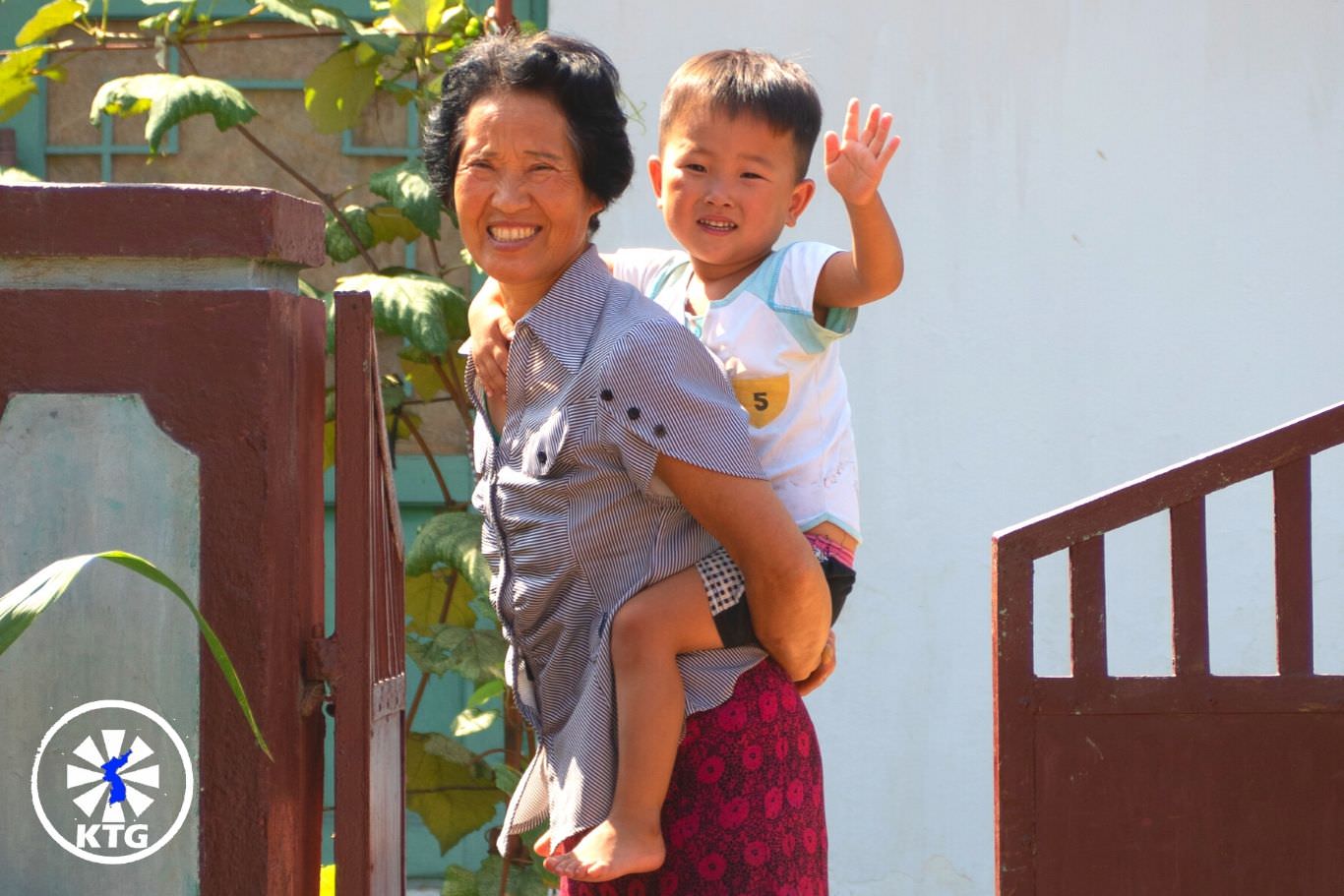 Grandmother and grandson in a cooperative farm near Nampo city in North Korea. Trip arranged by KTG Tours