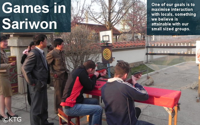 KTG travellers playing a shooting game with North Koreans in the city of Sariwon, capital of North Hwanghae Province, DPRK
