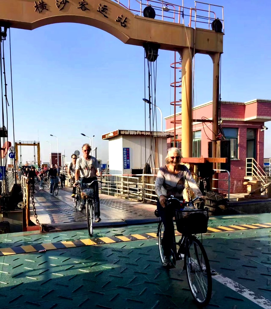 Getting off the boat in Hengsha island in China and starting our bike tour