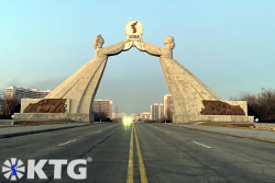 Arch of reunification seen from the middle of the reunification highway, Tongil highway, in Pyongyang, capital of North Korea, DPRK