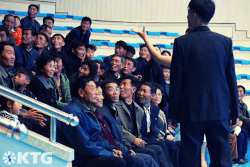 Crowd of North Koreans laughing at the Rungna Dolphinarium in Pyongyang North Korea