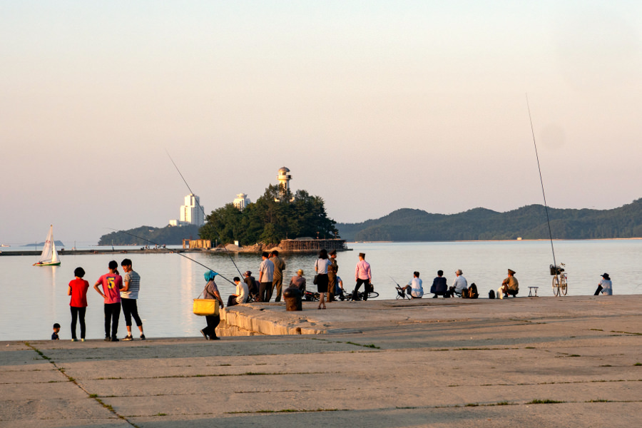 North Koreans gathering by the docks in Wonsan city, Kangwon province, North Korea (DPRK). Trip arranged by KTG Tours