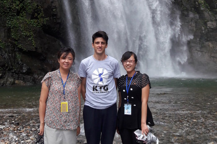 Ullim waterfalls in North Korea. KTG staff member with local North Korean guides