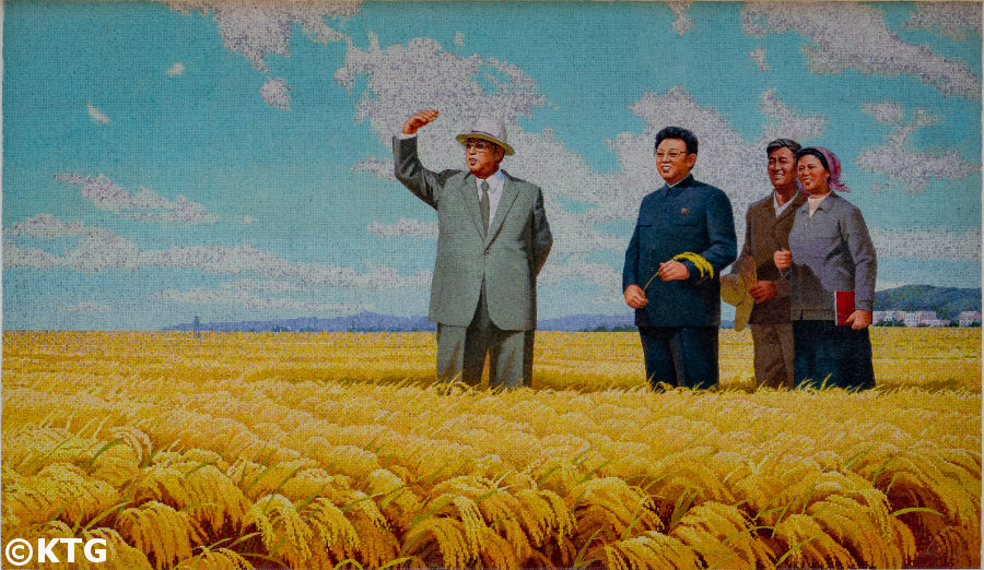 Mosaic of President Kim Il Sung and Chairman Kim Jong Il at a farm. Trip arranged by KTG Tours