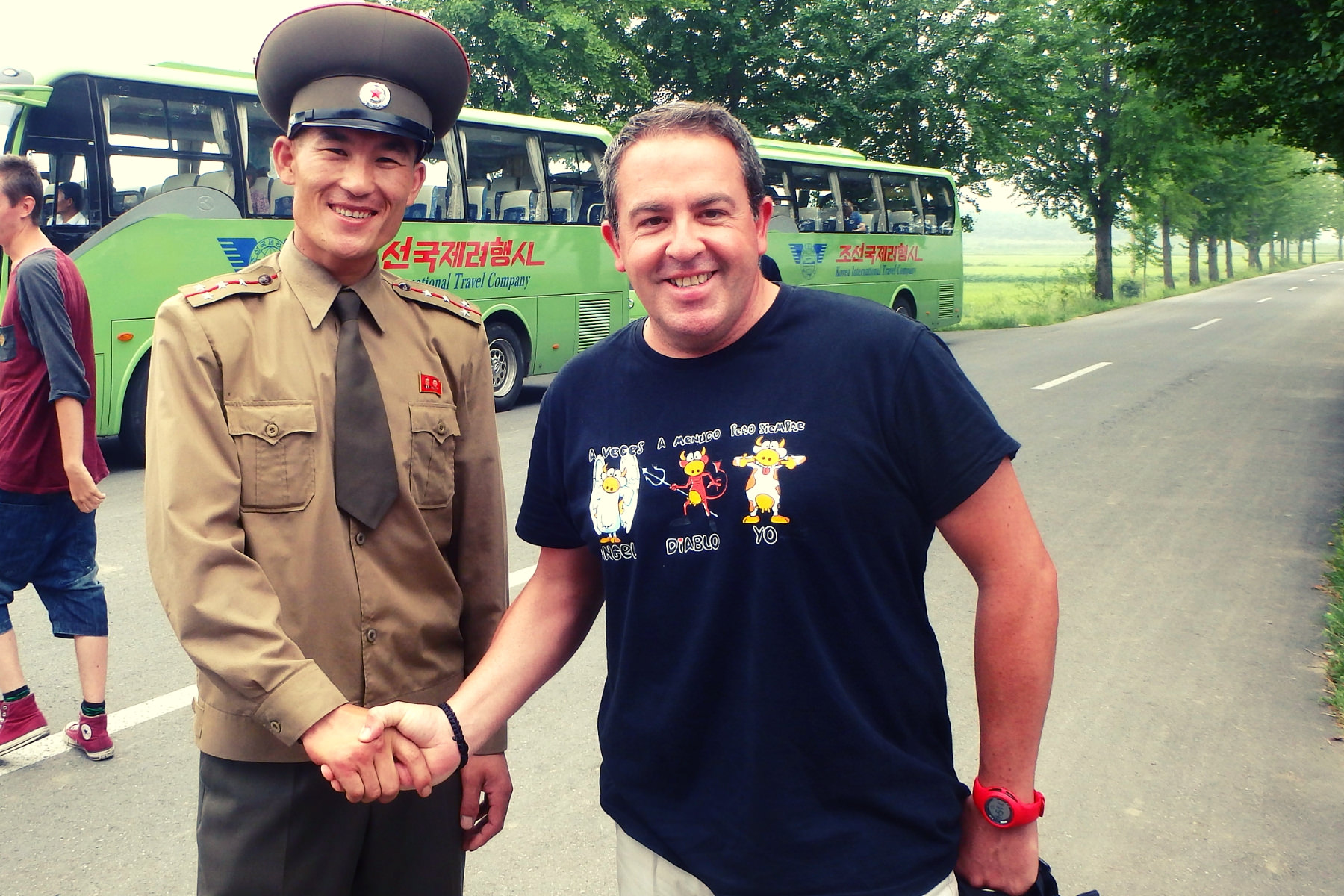KTG traveller shakes hand with a North Korean soldier at the DMZ in North Korea. Panmunjom is the only place in the DPRK where we can take pictures of the North Korean military