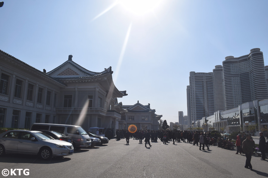 People queuing outside the Okryu restaurant in autumn in Pyongyang, North Korea, DPRK. Picture taken by KTG Tours