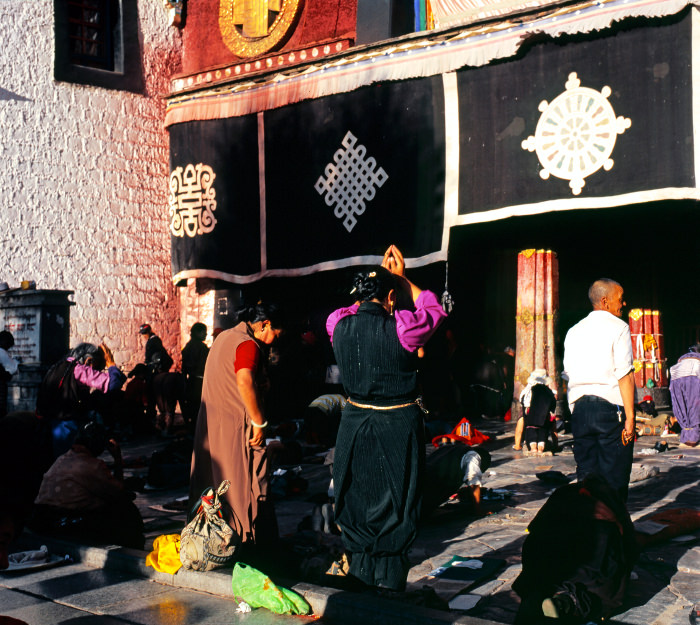 Pilgrims praying at Jokhang Temple in Lhasa Tibet, China.