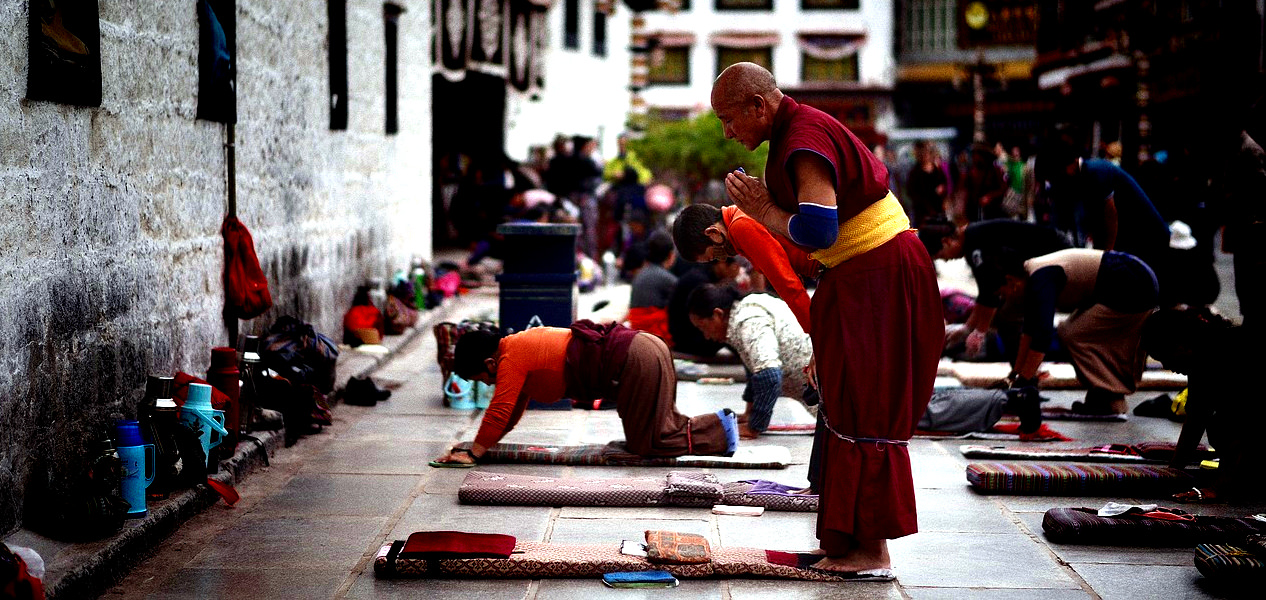 Tibetans praying at Jokhang Temple in Lhasa in Tibet, China. Pilgrims from all around Tibet come to this temple, the most important religious building in Tibet.