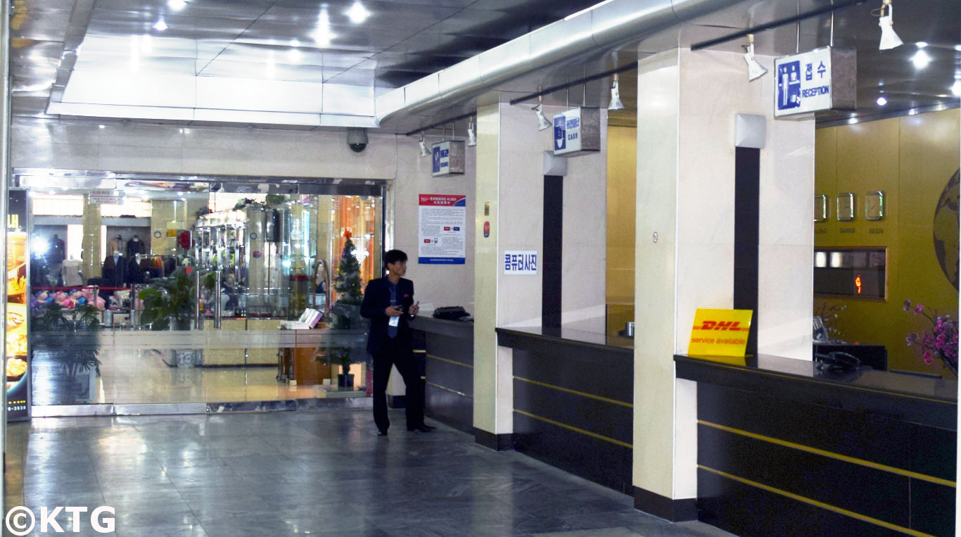 Reception at the Pyongyang Hotel in North Korea, DPRK. Notice the DHL sign!