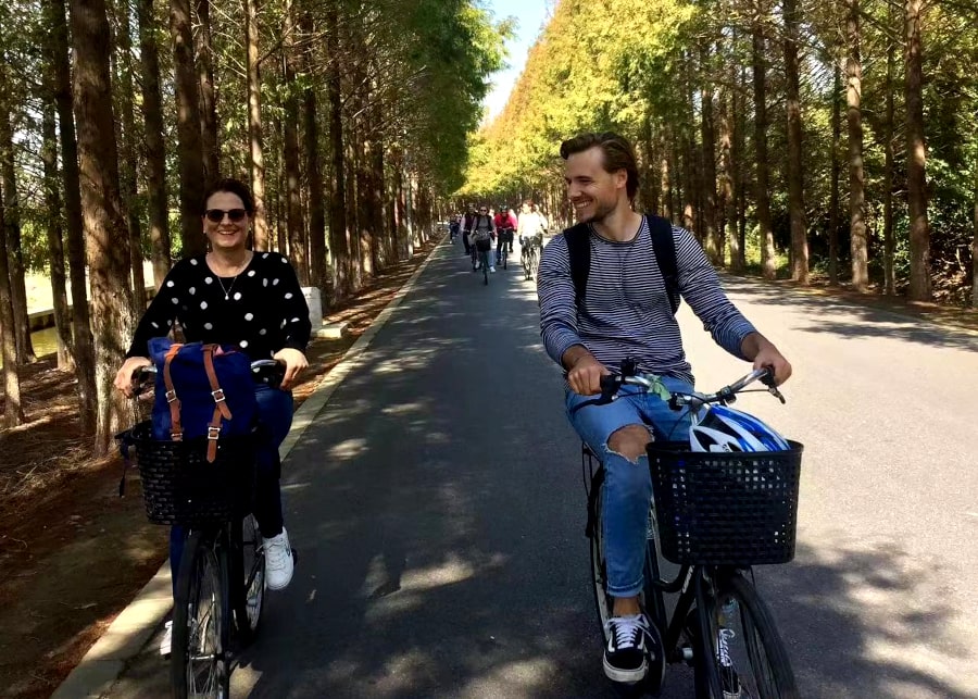Bike ride Hengsha island between trees, China