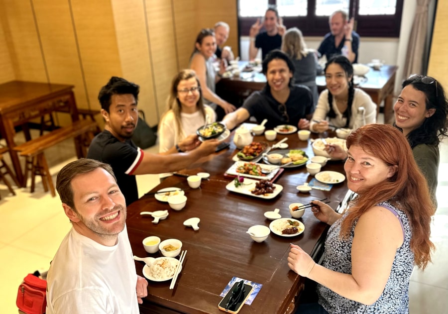 Travellers eating at a Chinese restaurant in Shanghai, China, on our bike & food tour of Shanghai