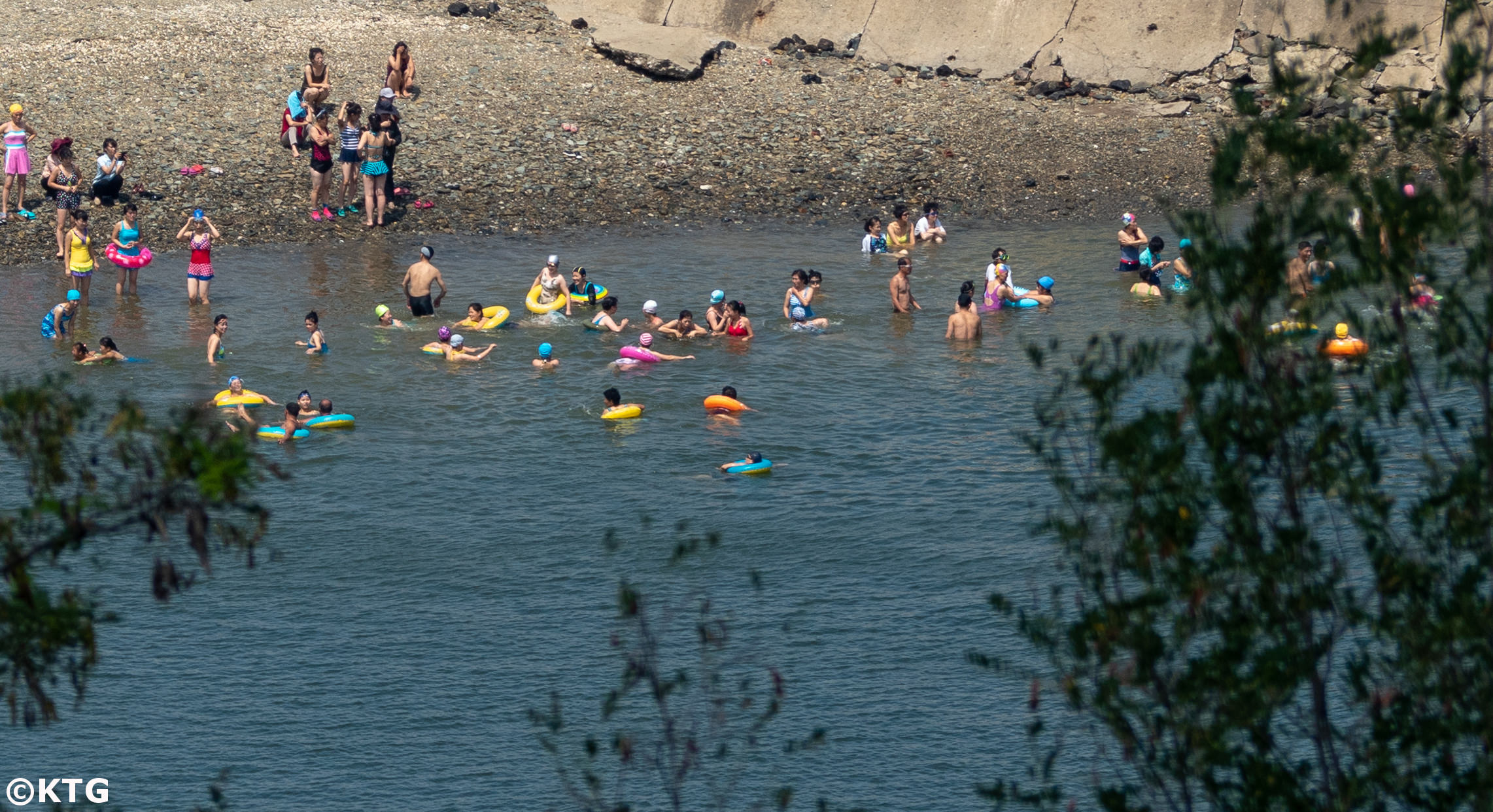 North Koreans swimming in the sea and enjoying a day at the beach in Nampo city. Picture taken by KTG tours