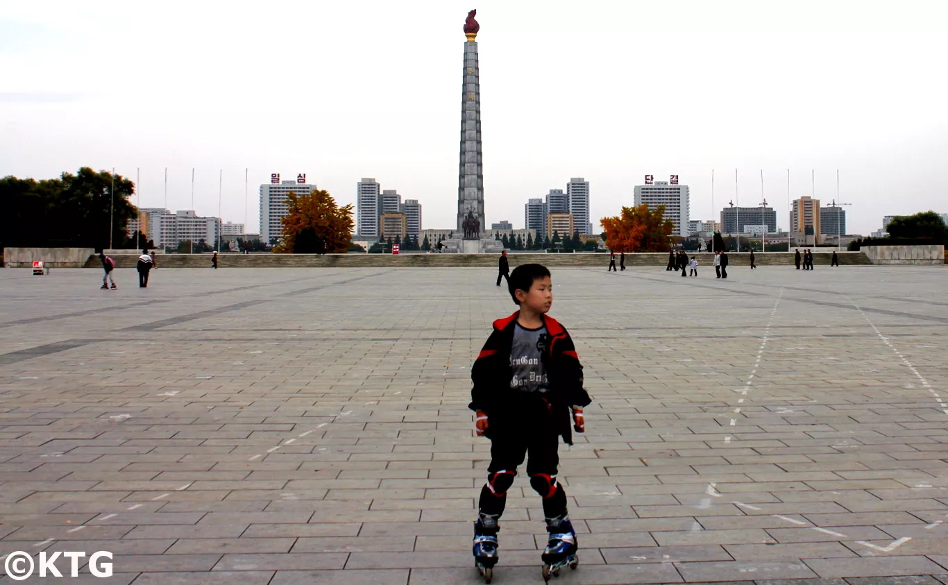 Child roller skating in Kim Il Sung Square, the heart of Pyongyang capital of North Korea (DPRK). Join KTG Tours to discover Kim Il Sung Square!