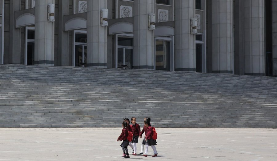 North Korean children marching in a street rally in Hamhung