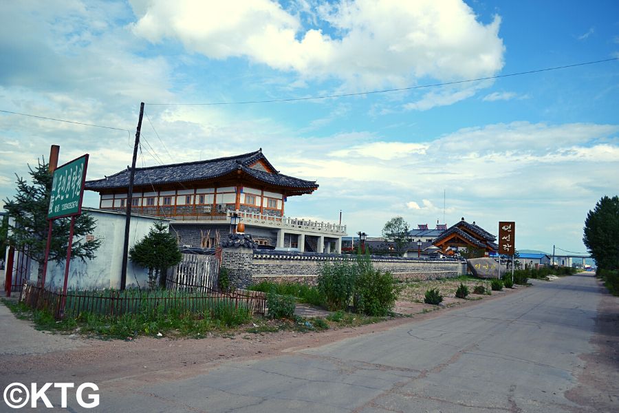 Boat ride by a brigde in the Yalu river that connects China and North Korea at Hekou village, near Dandong, border city with North Korea (DPRK). Tour arranged by KTG Tours