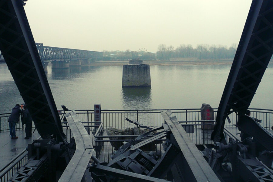 The Yalu River broken brigde in Dandong city, China, offers close up views of Sinuiju city in North Korea, DPRK. Trip arranged by KTG Tours