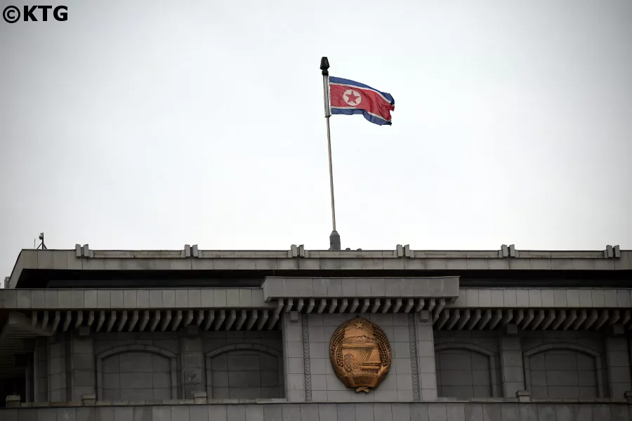 North Korean flag and DPRK emblem at the Kumsusan Palace of the Sun aka the Kumsusan Memorial Palace in Pyongyang, North Korea, DPRK. Trip arranged by KTG Tours