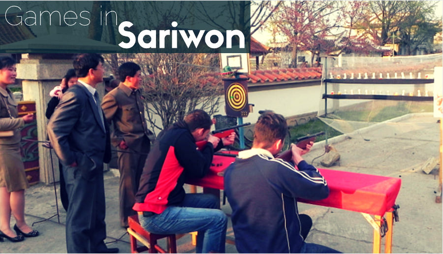 Western tourists playing a shooting game in Sariwon, North Korea (DPRK)