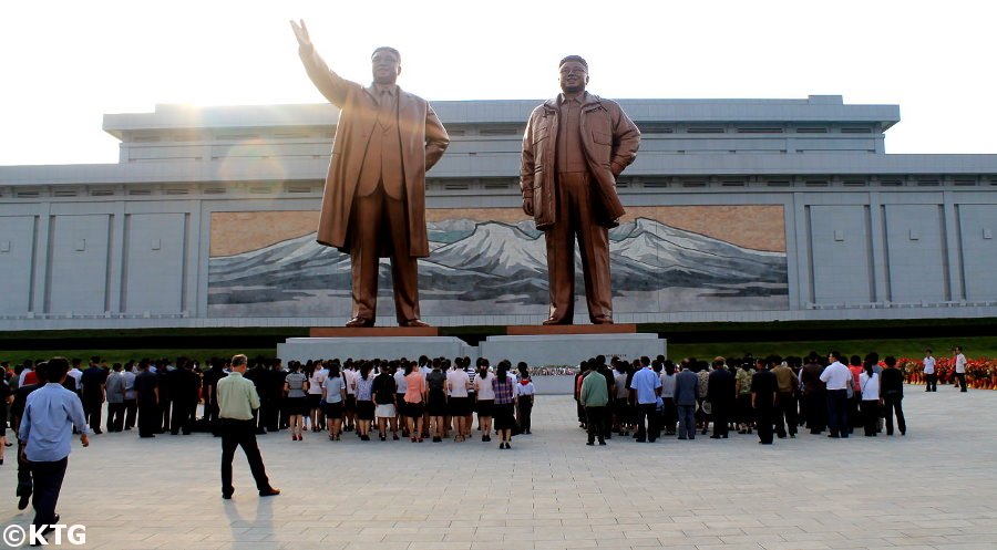 Mansudae Grand Monuments in Pyongang capital of North Korea, DPRK, with KTG Tours. These giant bronze statues of the Leader Kim Il Sung and Kim Jong Il are visited by locals regularly