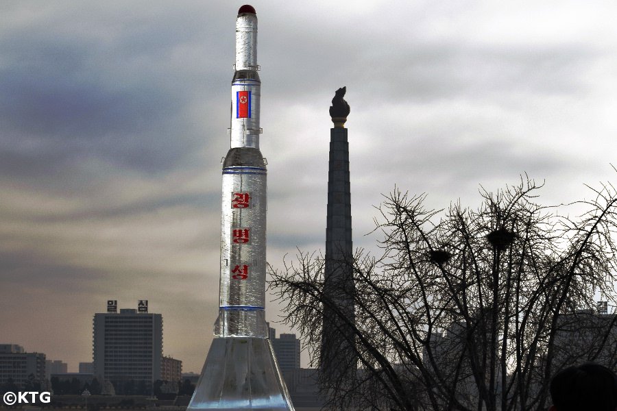 North Korean Ice Rocket sculpture in Kim Il Sung Square with the Juche Tower in the background