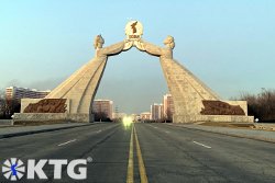 Arch of reunification seen from the middle of the reunification highway, Tongil highway, in Pyongyang, capital of North Korea, DPRK