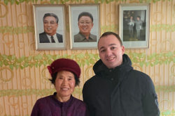 KTG traveller with farmer in her house near Nampo city, North Korea, DPRK
