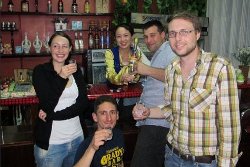 KTG travellers having a drink with a North Korean lady at the bar at the Kaesong Folk Hotel. The minsok hotel is located in the old part of town of Kaesong city in North Korea, DPRK