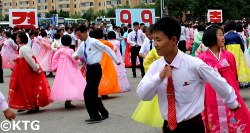 Mass Dances in Pyongyang to celebrate National Day in the DPRK ie North Korea. This is by the party foundation monuments. Picture taken by KTG Tours