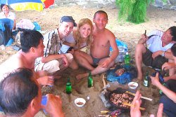 KTG travellers having a drink with North Koreans at Majon beach in North Korea, DPRK