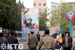 north Koreans entering and underpass that leads to the Pyongyang metro in the DPRK