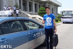 Air Koryo taxi by the Grand People's Study House in Pyongyang capital of North Korea (DPRK). Picture taken by KTG Tours