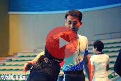 Trainer with a seal at the Rungna Dolphinarium in Pyongyang North Korea