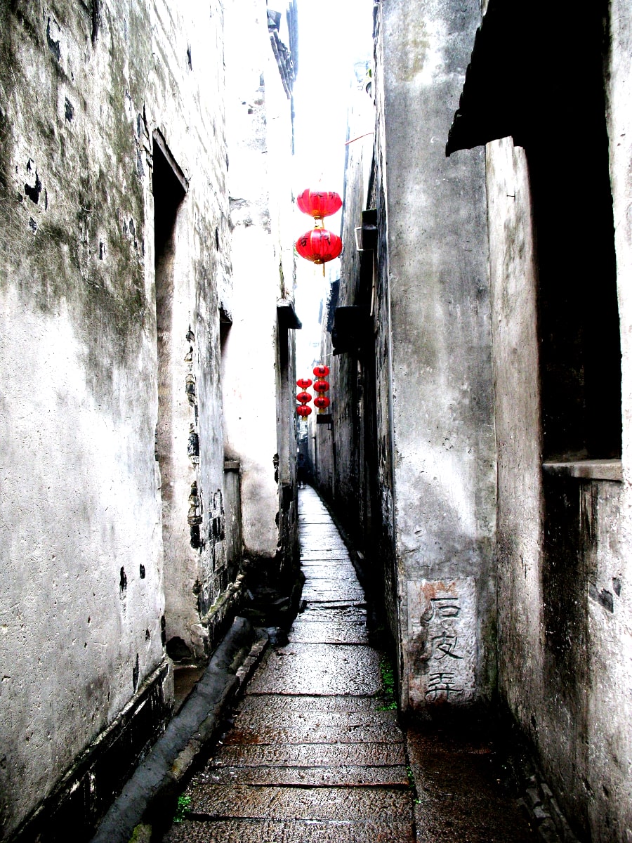 Narrow alleyway in the ancient water town of Xitang in Zhejiang province in southern China and near the city of Shanghai