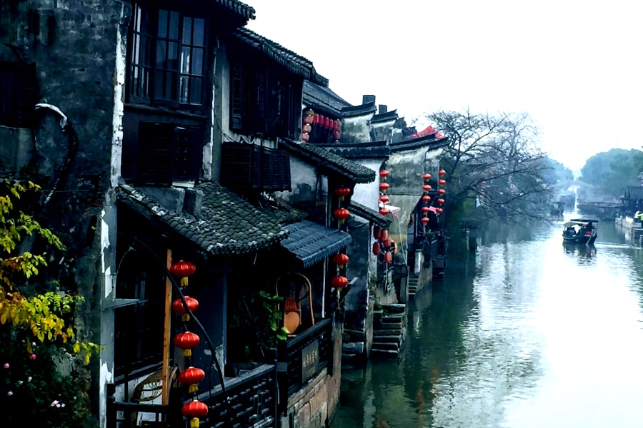Old houses beside the canal in the ancient canal town of Xitang in Zhejiang province in southern China and near the city of Shanghai