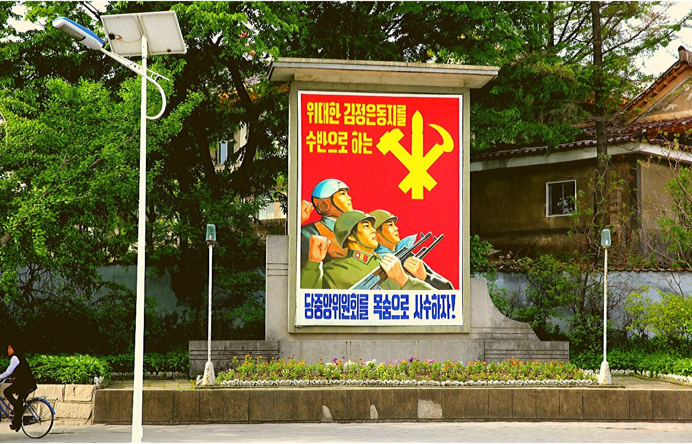 North Korean propaganda poster of soldiers in Kaesong, DPRK. Trip arranged by KTG Tour