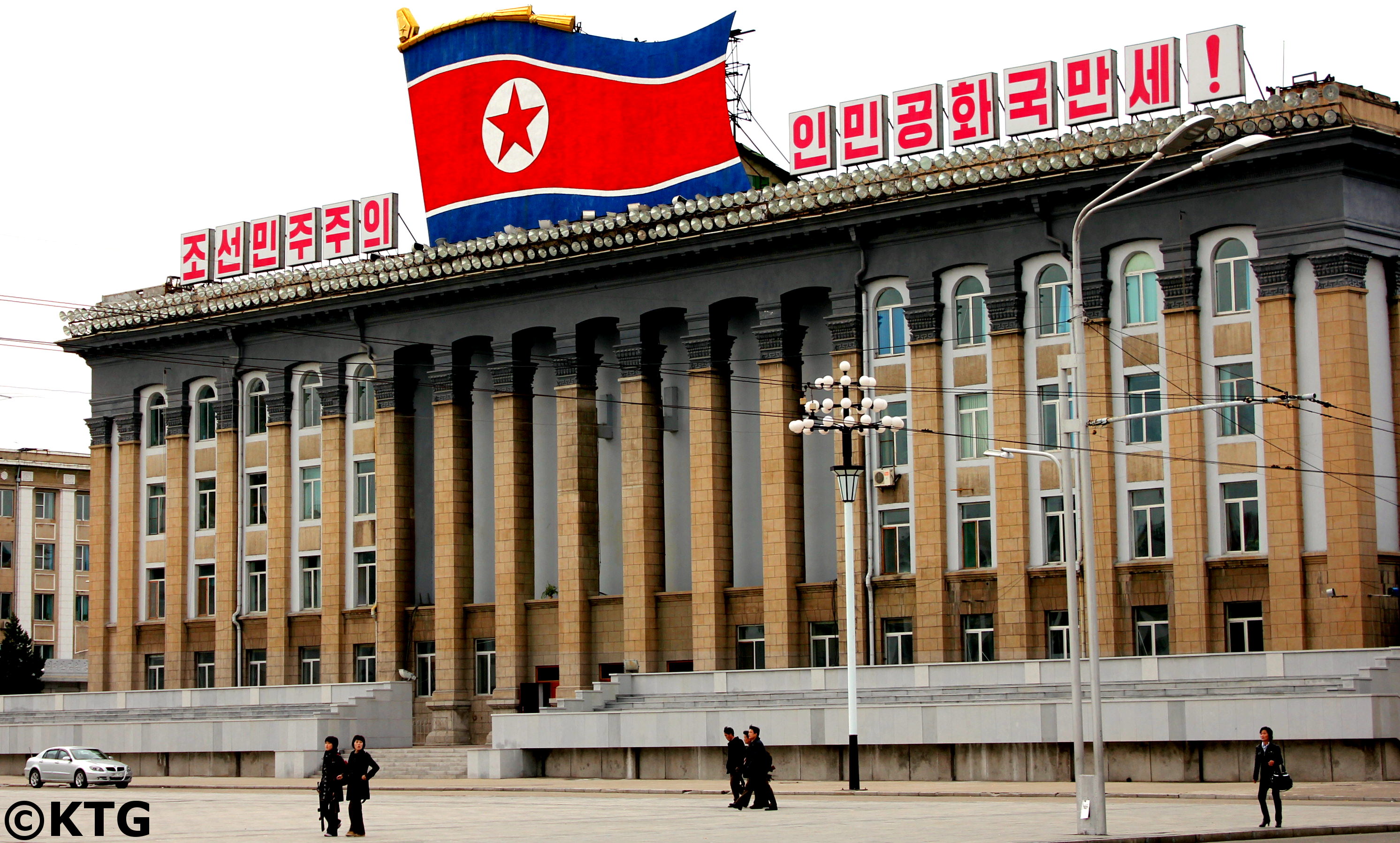 Building of agriculture ministry in Kim Il Sung Square. This was taken down and a portrait of an older and smiling President Kim Il Sung was placed at the base of the square together with that of Leader Kim Jong Il. Picture taken by KTG Tours