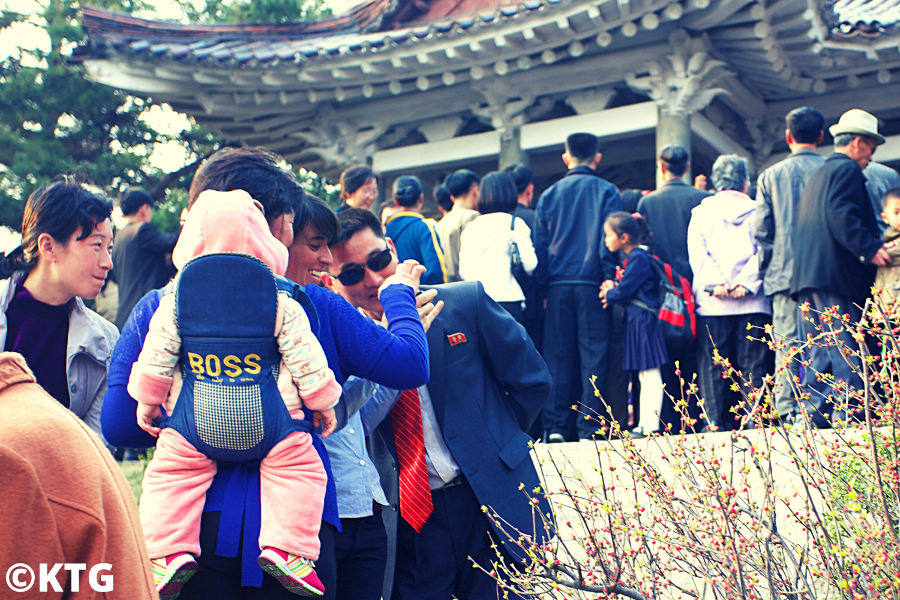 KTG traveller in Pyongyang, capital of North Korea, with locals celebrating the birthday of DPRK Eternal Presidente Kim Il Sung on 15 April