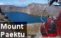 Yendo en teleférico al lago Chon en el Monte Paektu en Corea del Norte (la RPDC)