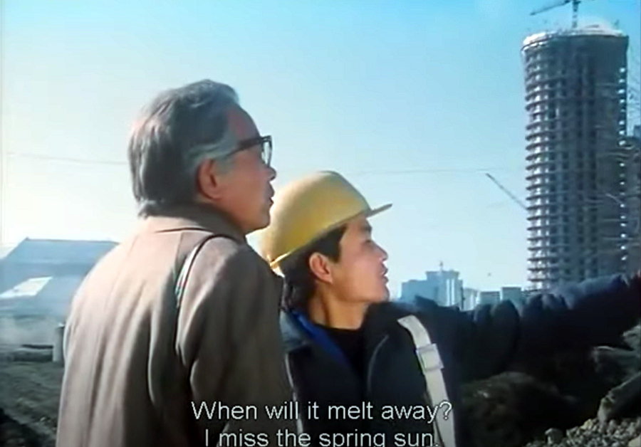 DPRK Movie the Country I Saw Part One. Here we see the Japanese journalist Takahashi interviewing a North Korean worker at a construction site.