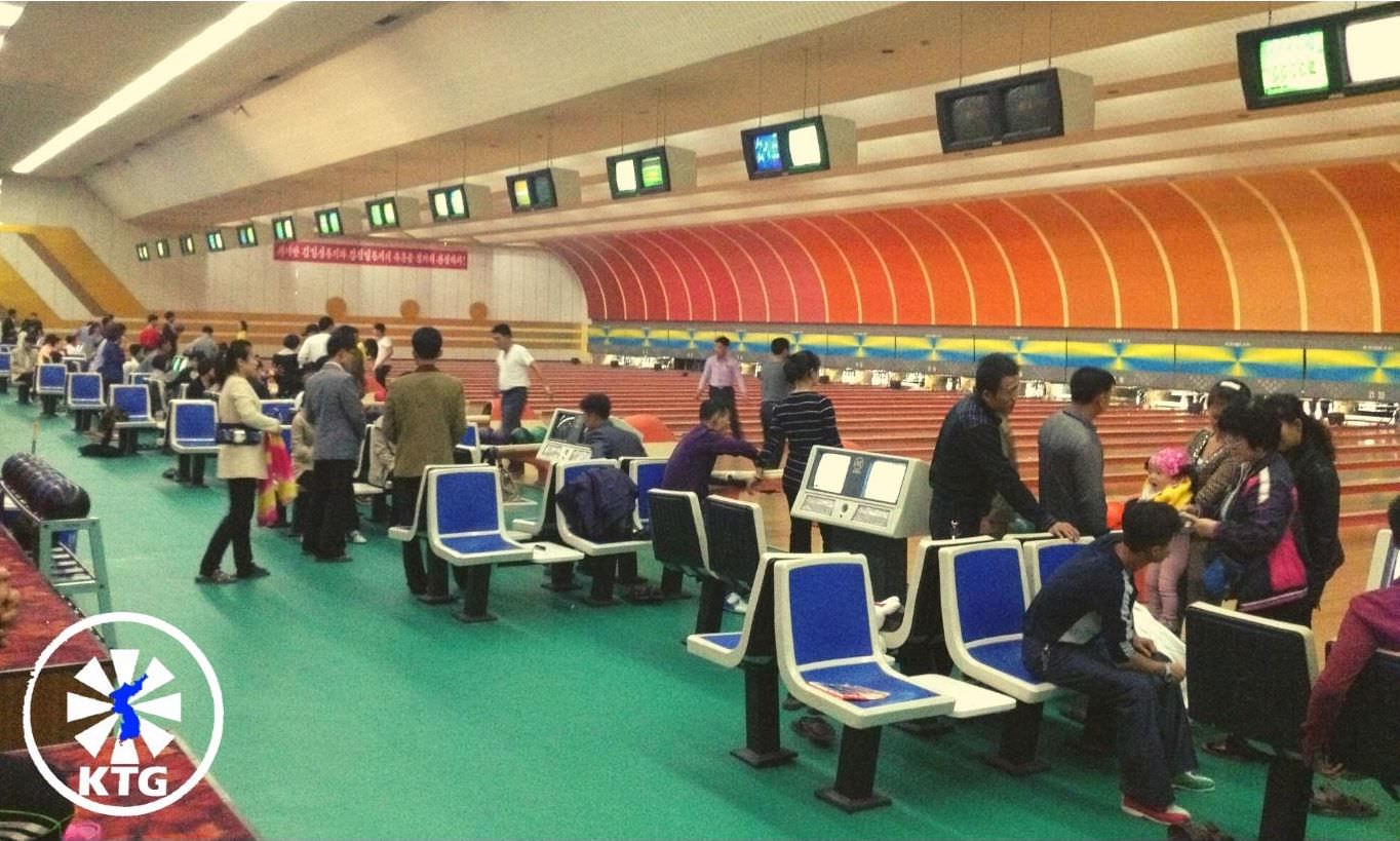 North Koreans bowling at the Pyongyang Gold Lane bowling alley in the capital of North Korea (DPRK). Trip arranged by KTG Tours