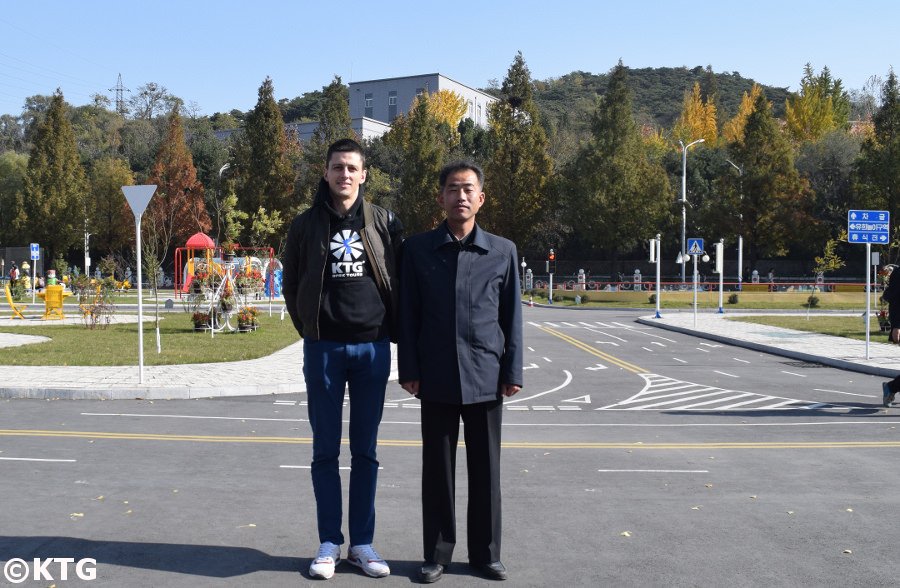 Director of the Pyongyang Children's Traffic Park with Rayco from KTG Tours, North Korea (DPRK)