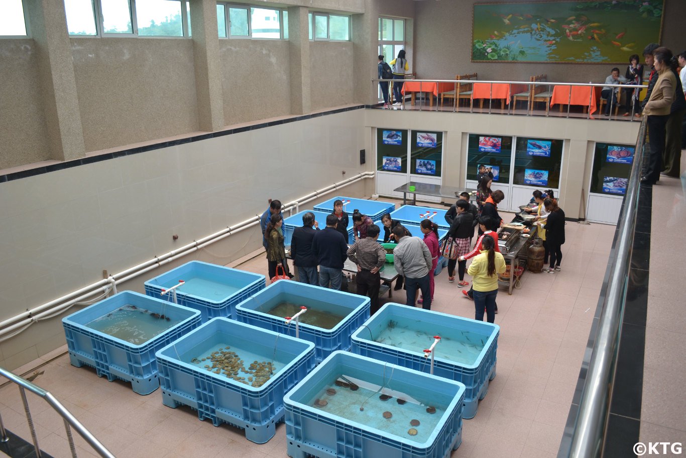 Travellers picking their food at the Taehung Rason Corporation in Rajin, DPRK (North Korea). KTG Tours