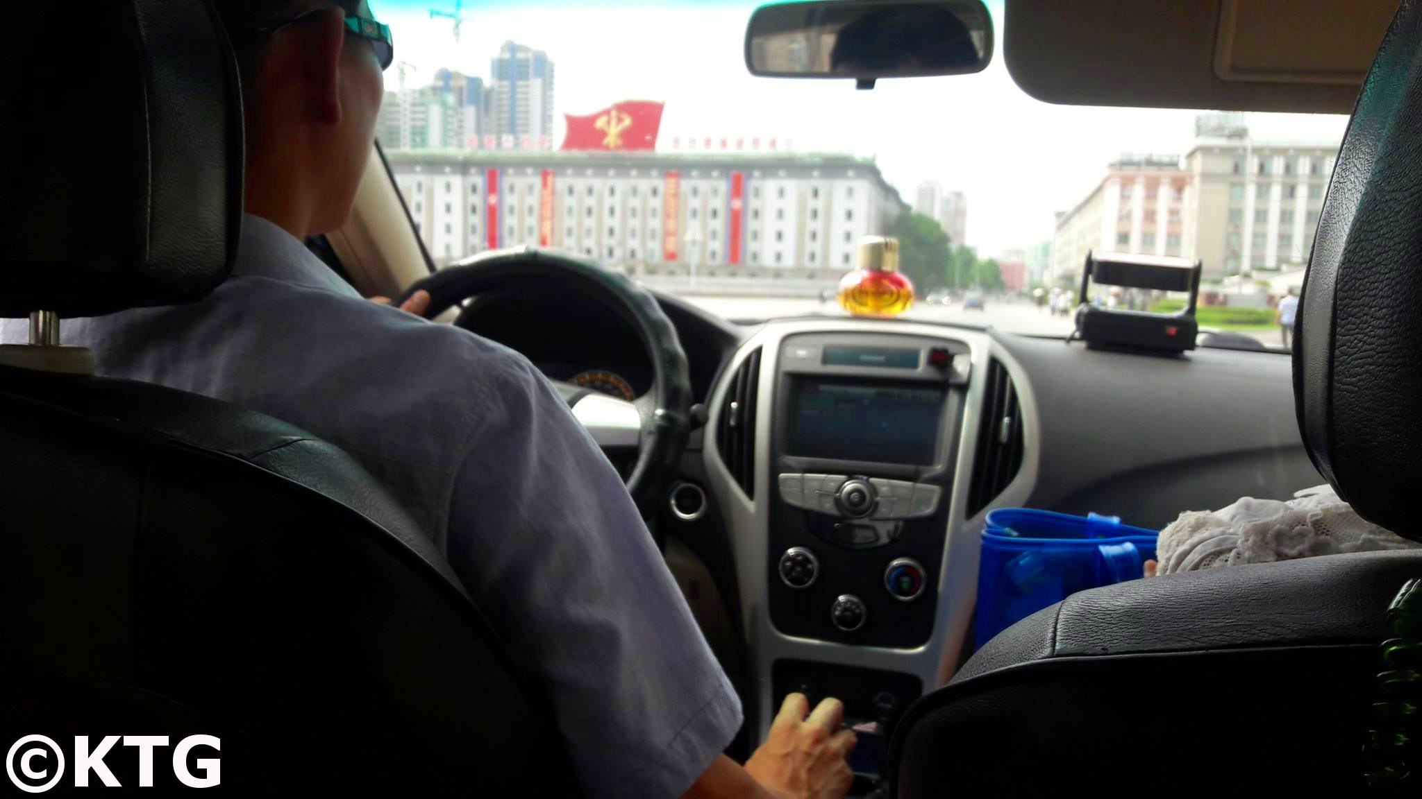 Driving by Kim Il Sung Square. You can see the Foreign trade minisry building in the background