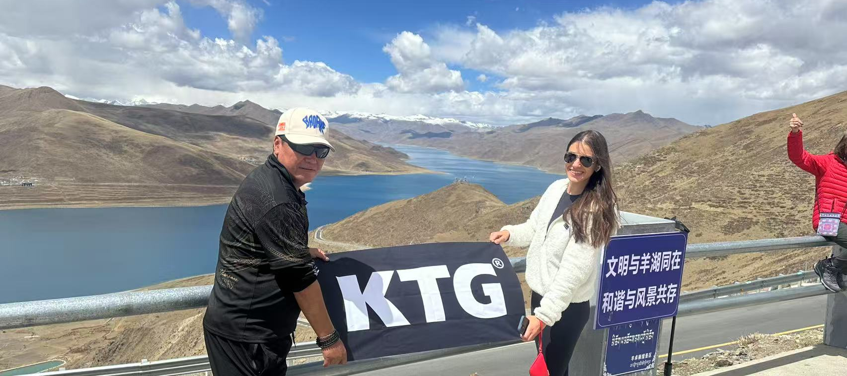 Traveller at Yamdrok lake with KTG guide, Tibet