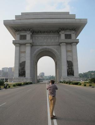Taking a picture in the middle of the highway of the Arch of Triumph