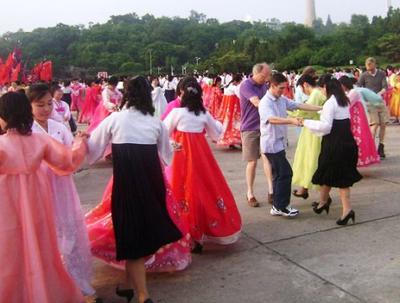 Dancing with locals on our first day in Pyongyang
